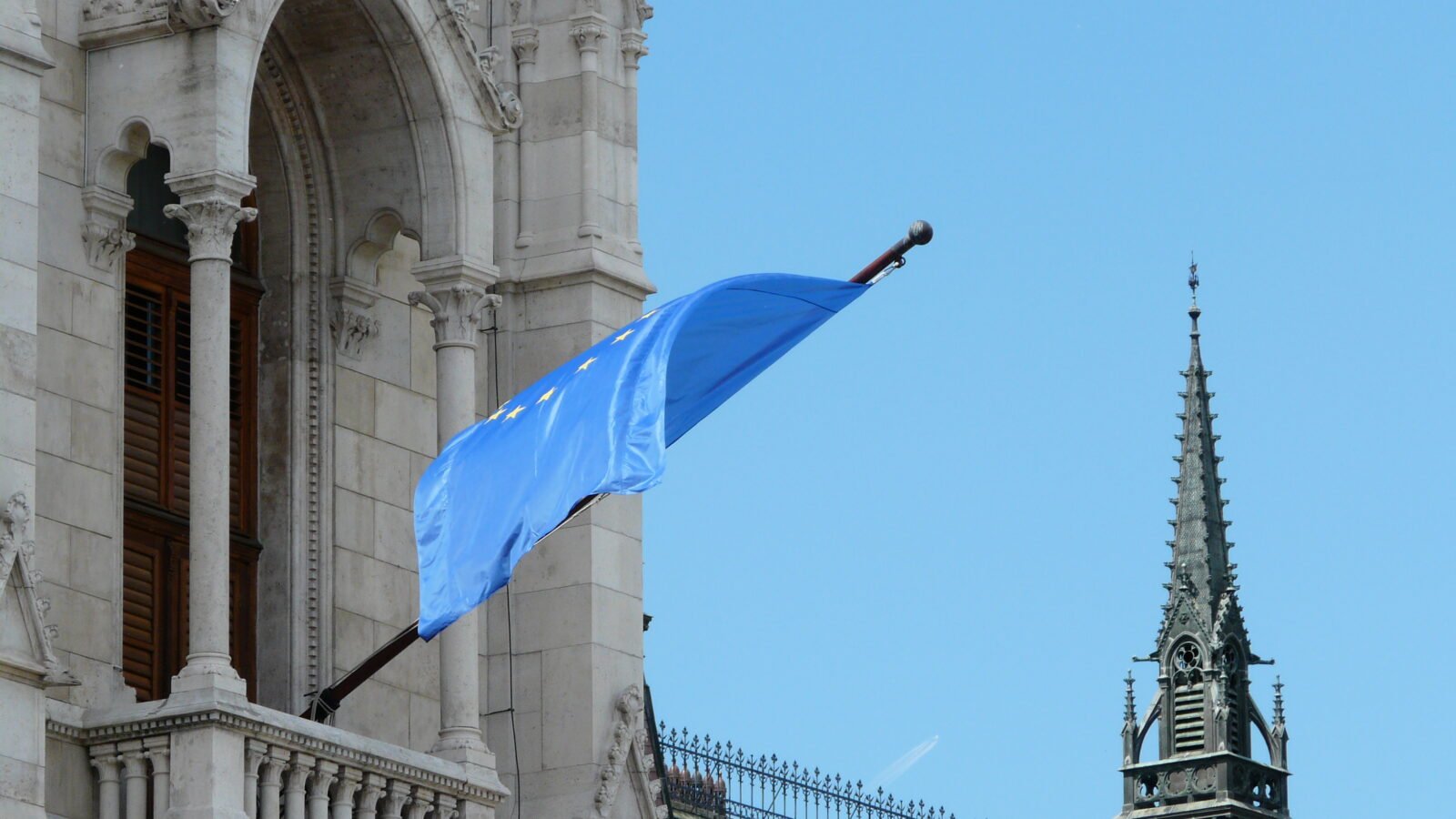 Thematic lead image: EU flags, European Parliament — Russian Dissidents Face Dual Sanctions from Moscow and European Capitals | National Times