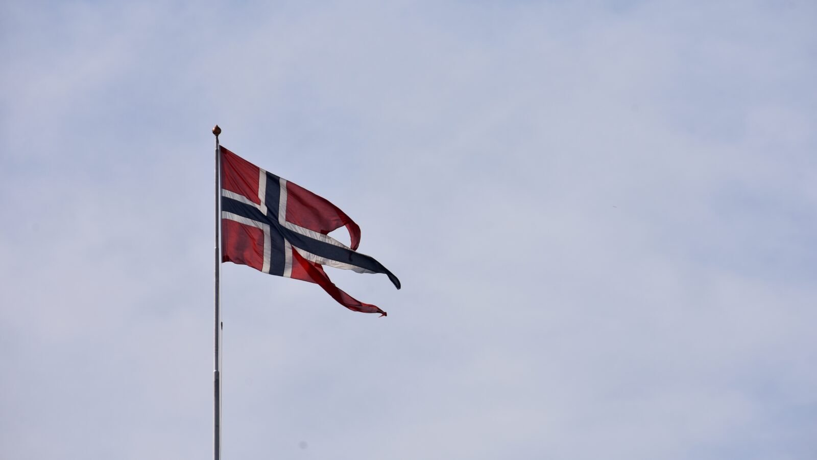 Thematic lead image: royal palace, flag, city — Norway's Royal Succession: Stability Amidst Shifting Constitutional Norms | National Times