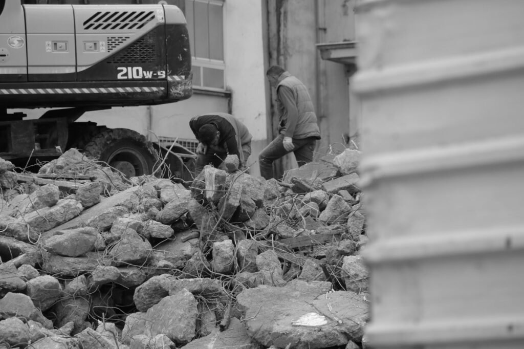 Thematic lead image: rubble, destroyed buildings, manual labour — Gaza's Reconstruction: A Test Case for International Accountability | National Times
