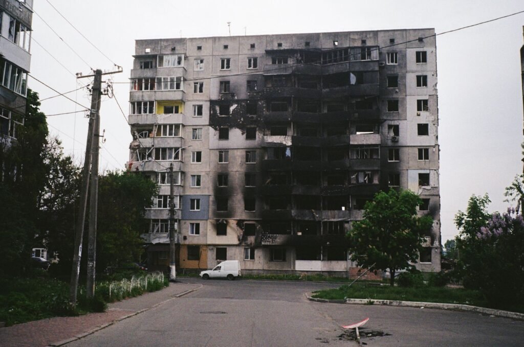 Thematic lead image: damaged warehouse, smoke, urban conflict — Kyiv warehouse strike: ammunition storage and strategic signalling | National Times