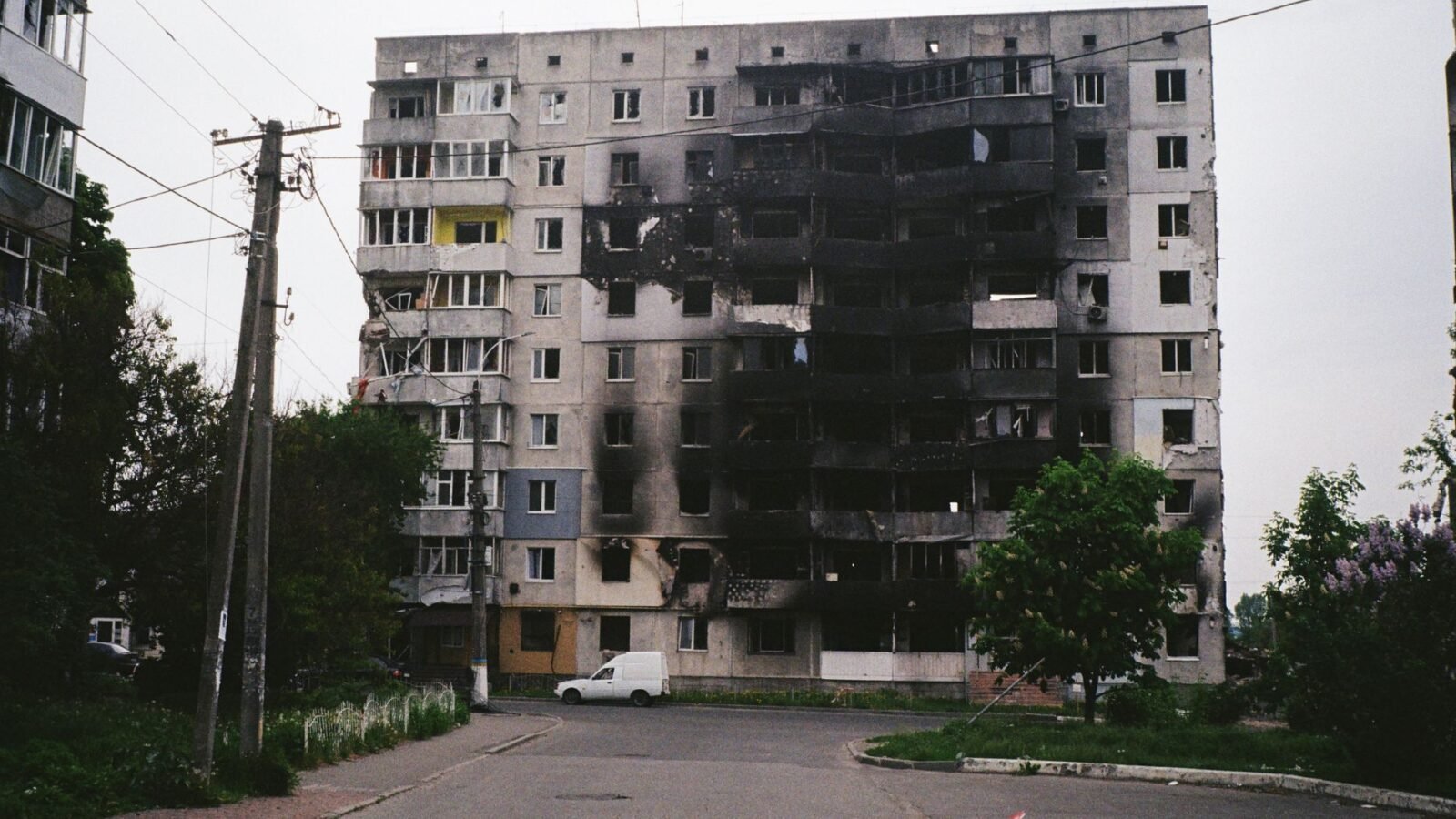 Thematic lead image: damaged warehouse, smoke, urban conflict — Kyiv warehouse strike: ammunition storage and strategic signalling | National Times