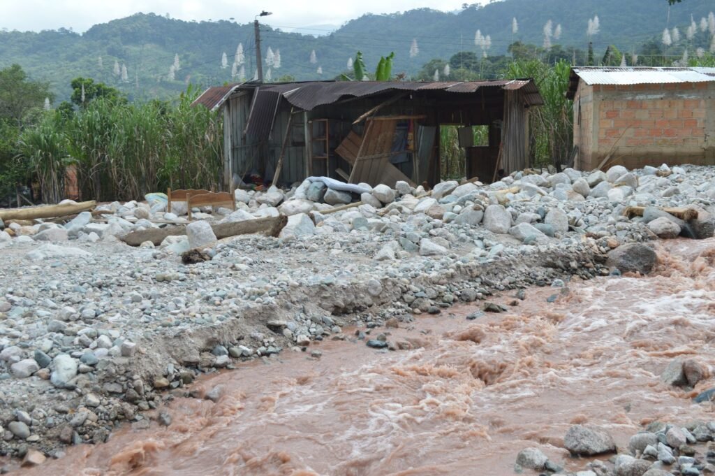 Thematic lead image: flood devastation, river, mountains — Nepal Floods Reveal State Capacity Deficits Amid Climate Strain | National Times