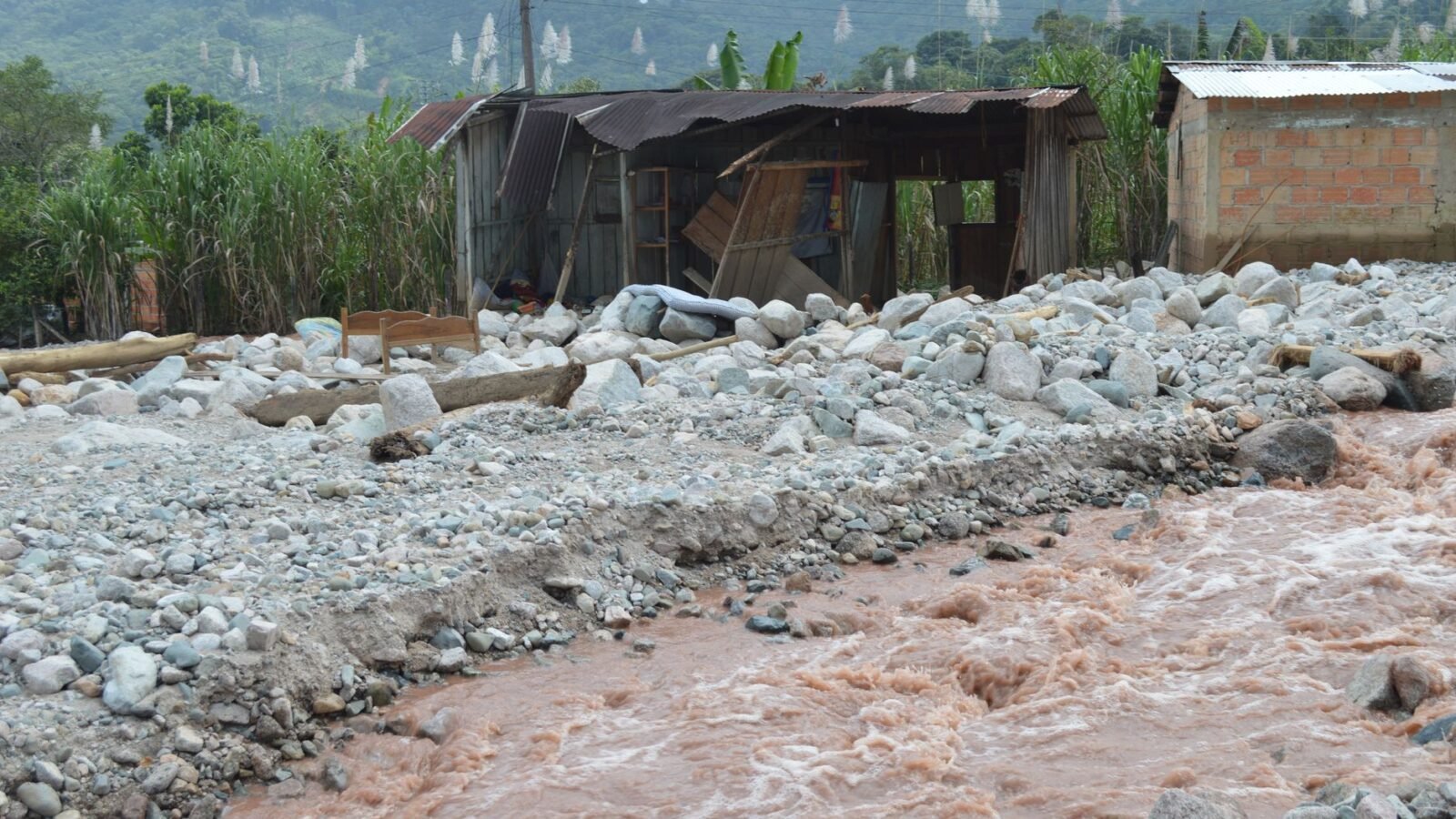 Thematic lead image: flood devastation, river, mountains — Nepal Floods Reveal State Capacity Deficits Amid Climate Strain | National Times