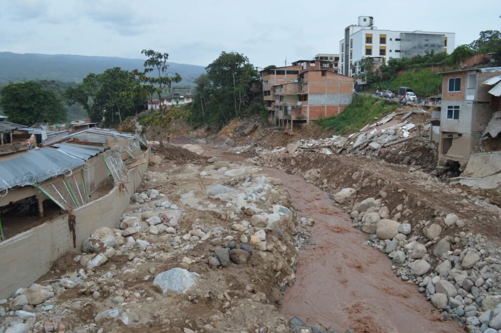 Thematic lead image: flood-damaged village, mountains — Nepal's Flood Future: Climate Migration and Hydropower Risks to 2030 | National Times
