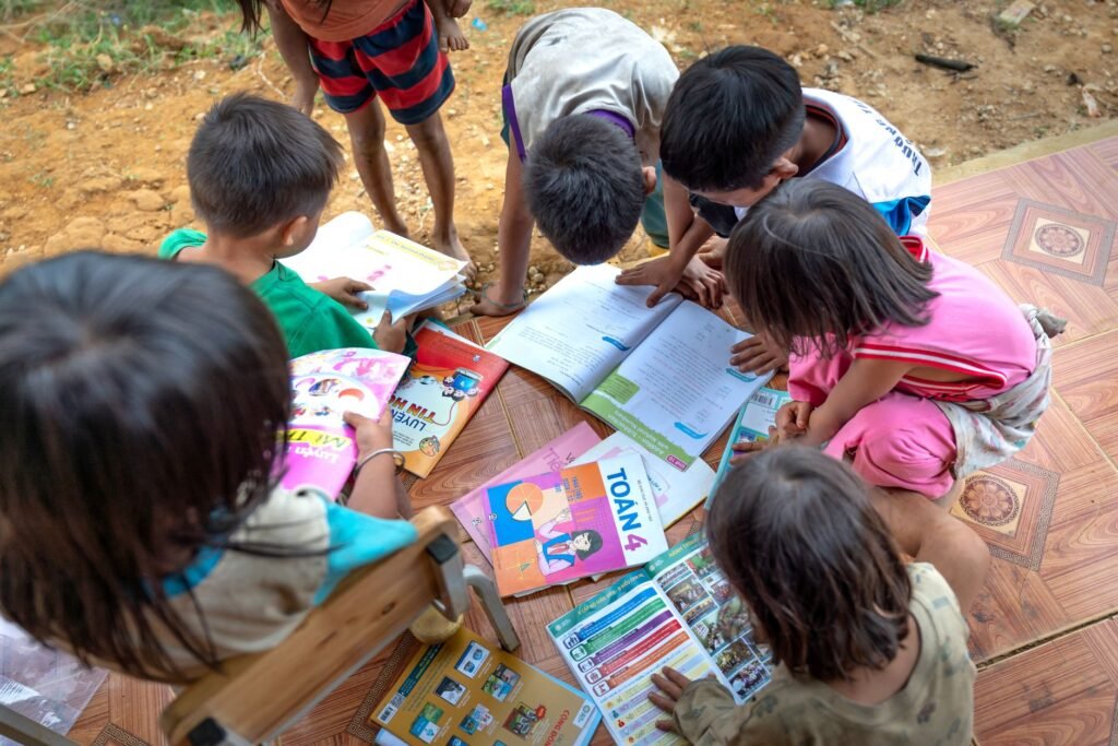 Thematic lead image: children reading books — Dolly Parton's Literary Philanthropy: An Unlikely Engine of Social Capital | National Times
