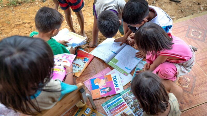 Thematic lead image: children reading books — Dolly Parton's Literary Philanthropy: An Unlikely Engine of Social Capital | National Times