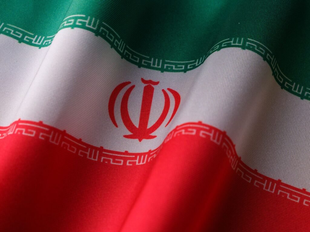 Thematic lead image: Iranian flag, economic sanctions — Iran's Retaliation Threat: Assessing the Economic and Geopolitical Calculus | National Times