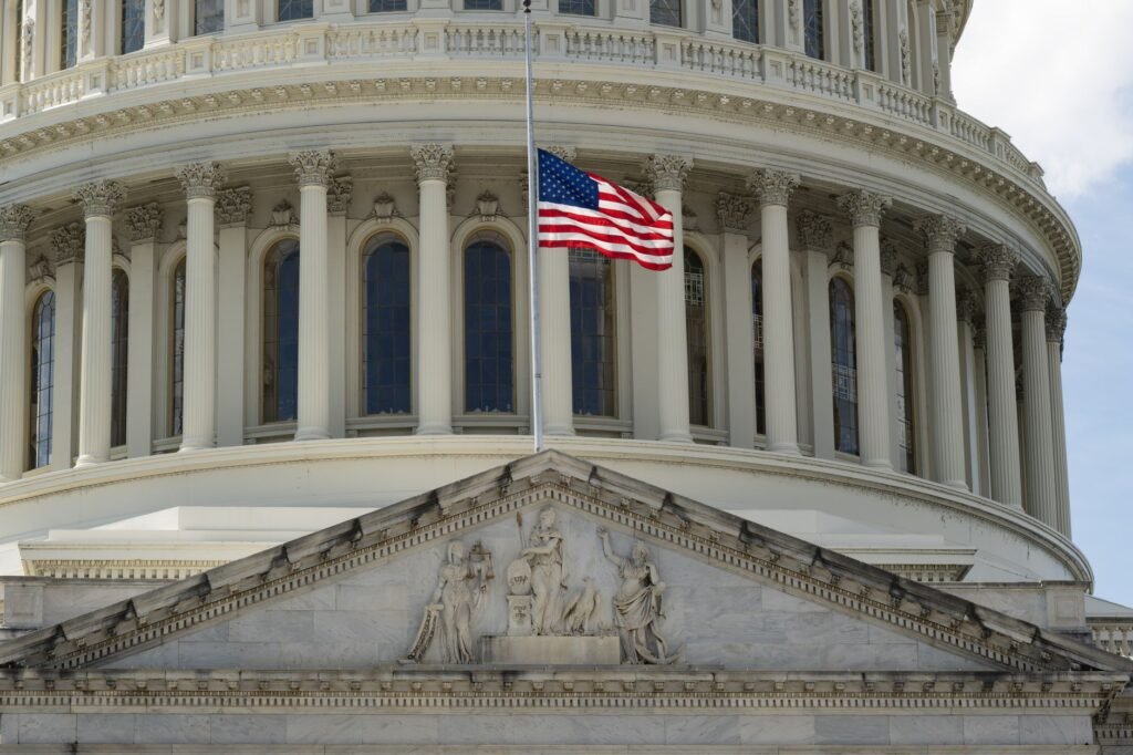Thematic lead image: US Capitol, Iraqi flag — US Revokes Iraqi Ex-Minister's Visa, Citing Terrorism Watchlist | National Times