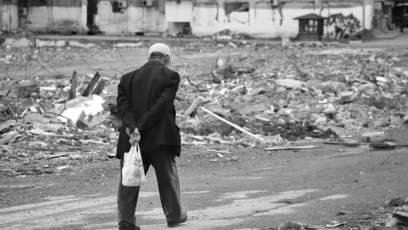 Thematic lead image: mass funeral amid rubble — Buried twice: what Gaza's 112 recovered bodies settle, and what they cannot | National Times