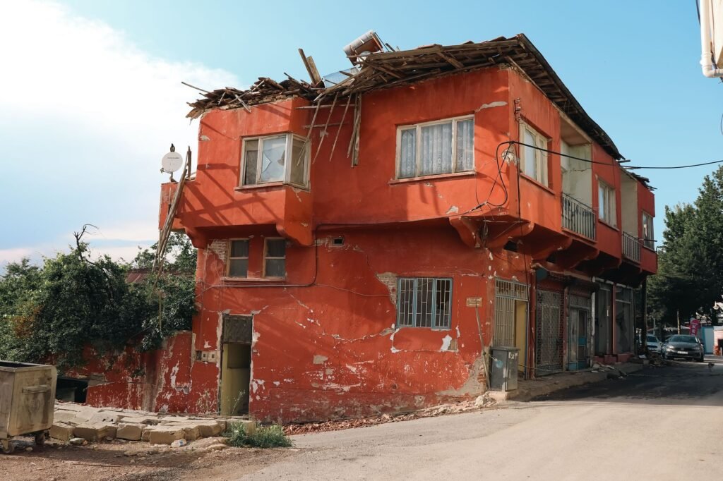Thematic lead image: damaged building, southern Lebanon — Lebanon's Southern Border: Escalation Pathways to 2030 | National Times