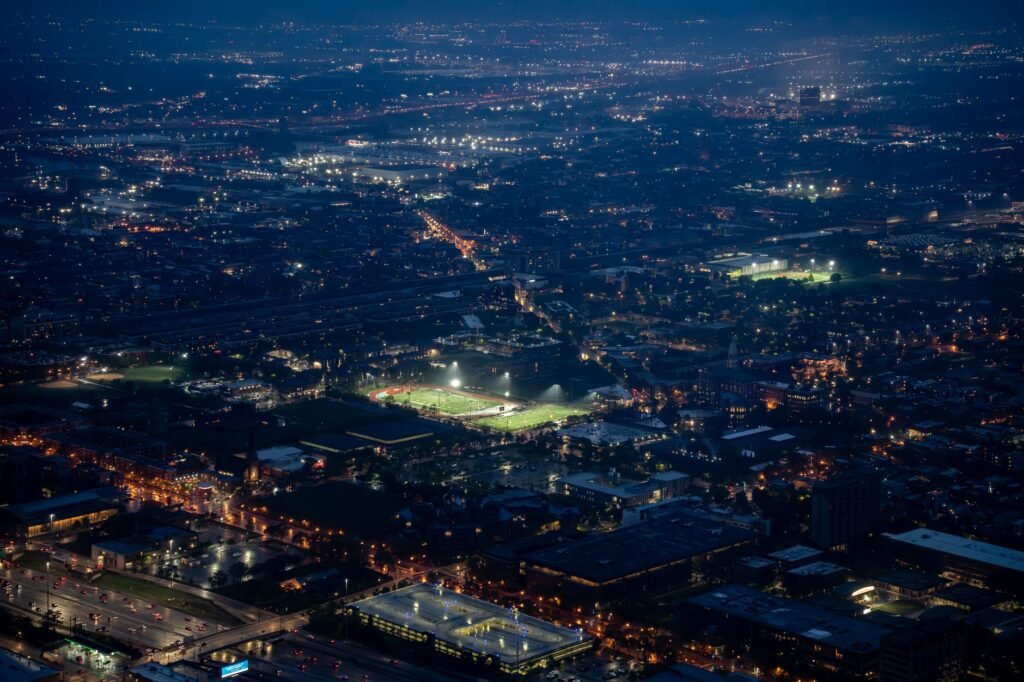 Thematic lead image: football stadium lights — Beyond the Pitch: The Economic Ripple of Football's European Dominance | National Times