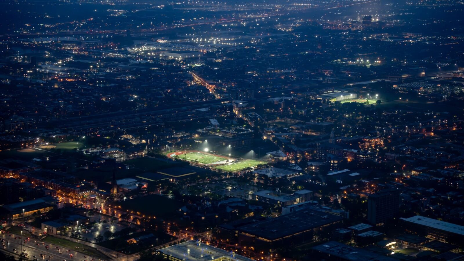 Thematic lead image: football stadium lights — Beyond the Pitch: The Economic Ripple of Football's European Dominance | National Times