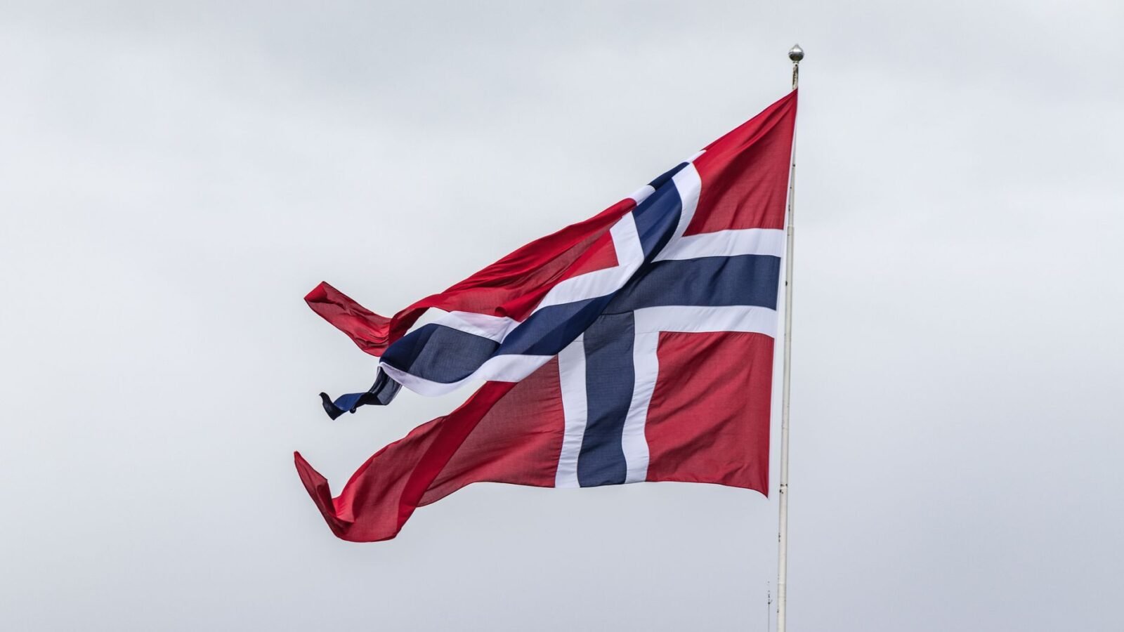 Thematic lead image: Oslo City Hall, Norwegian flag — Oslo Mayor's Wedding Cancellation Signals Royal Succession Dynamics | National Times