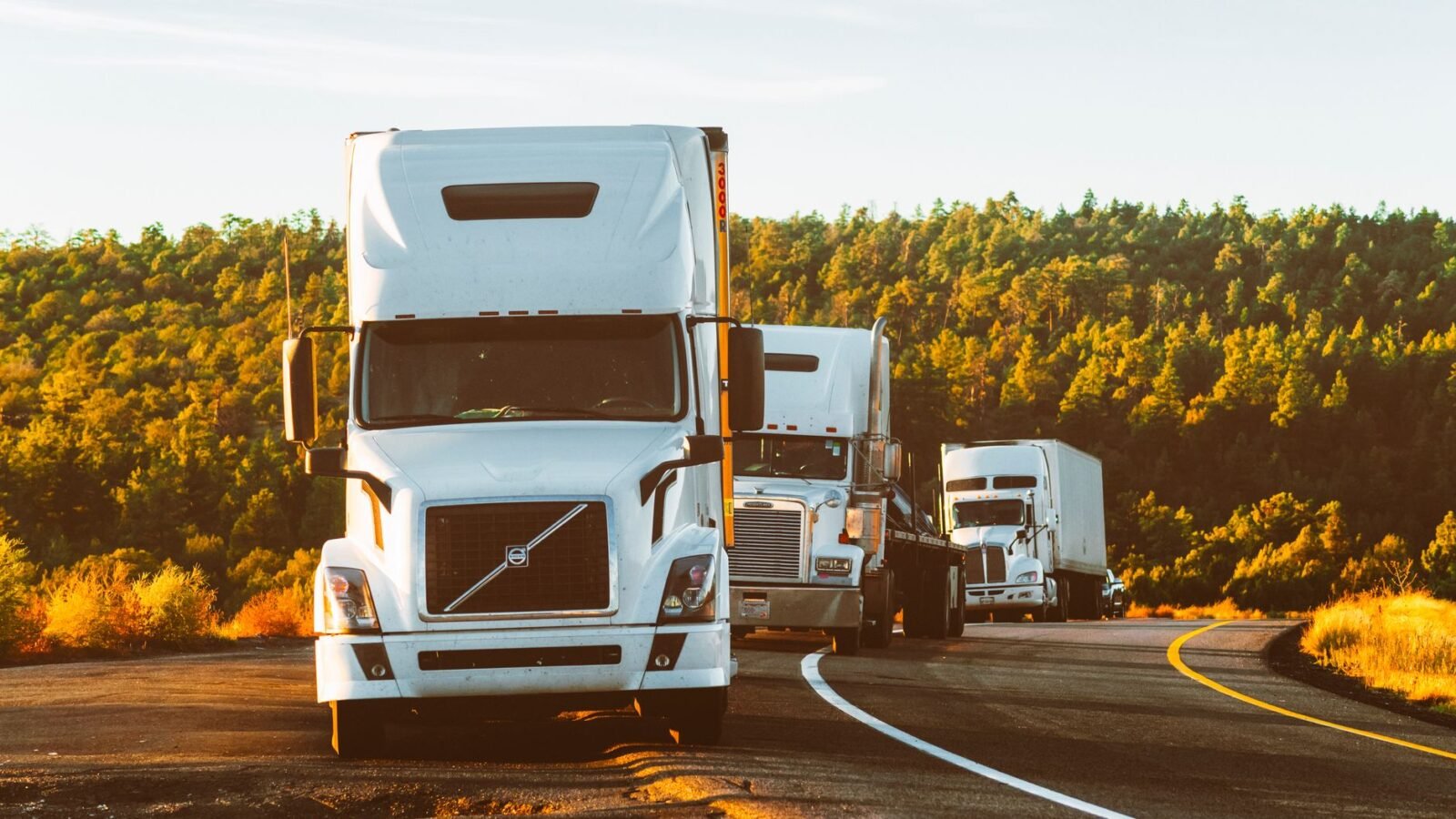 Thematic lead image: trucks, highway, logistics — Trucking Boom Exposes Deeper Infrastructure Strain in North America | National Times