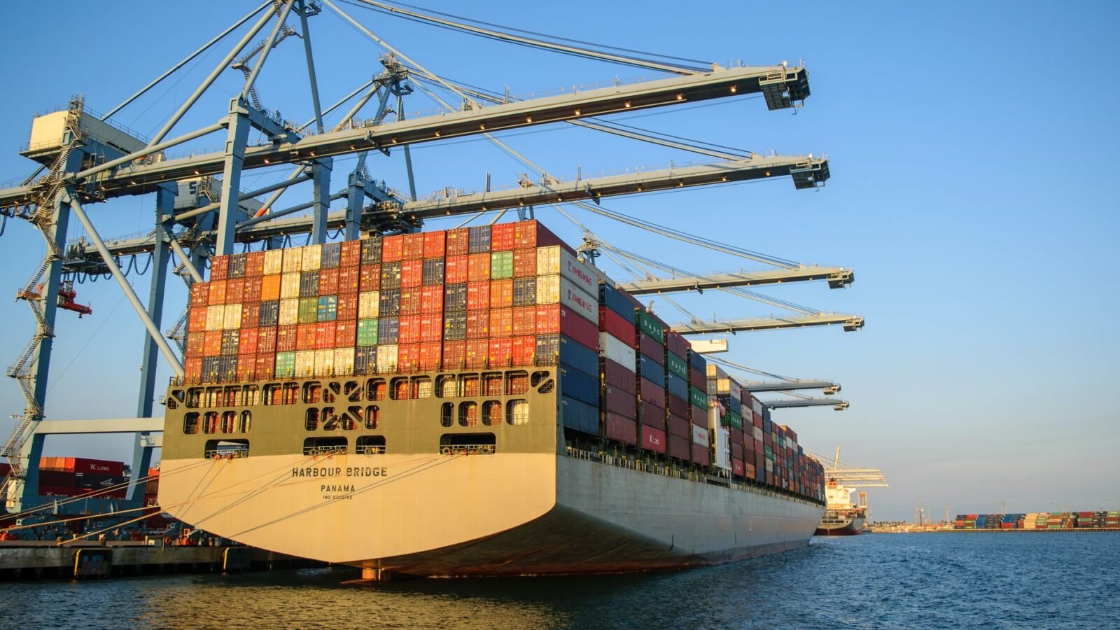Thematic lead image: shipping containers, tariffs, global trade — Target's Tariff Windfall Challenges US Trade Policy Effectiveness | National Times