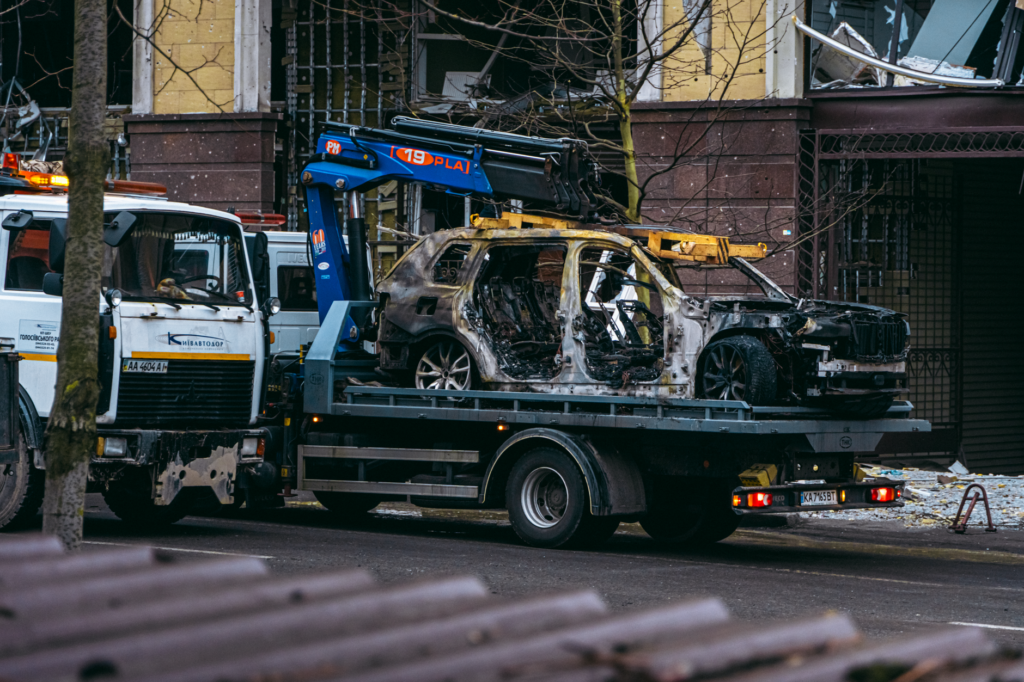 Thematic lead image: damaged warehouse, rescue operation — Kyiv Warehouse Strike: Unpacking Competing Narratives Amidst Civilian Casualties | National Times