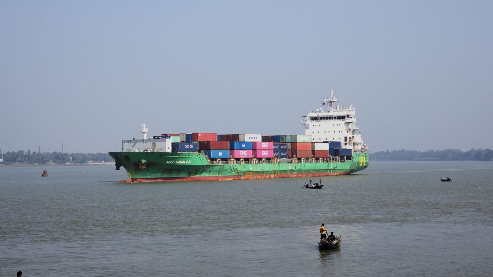 Thematic lead image: container ship riverbank — Hooghly River Incident Reveals Understated India Infrastructure Risk | National Times