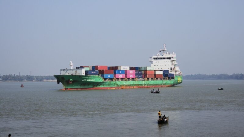 Thematic lead image: container ship riverbank — Hooghly River Incident Reveals Understated India Infrastructure Risk | National Times