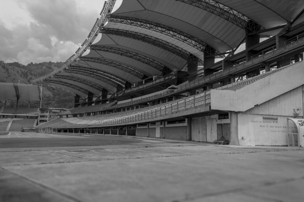 Thematic lead image: football stadium finance — Guimaraes Transfer Signals Deeper Premier League Financial Strain | National Times