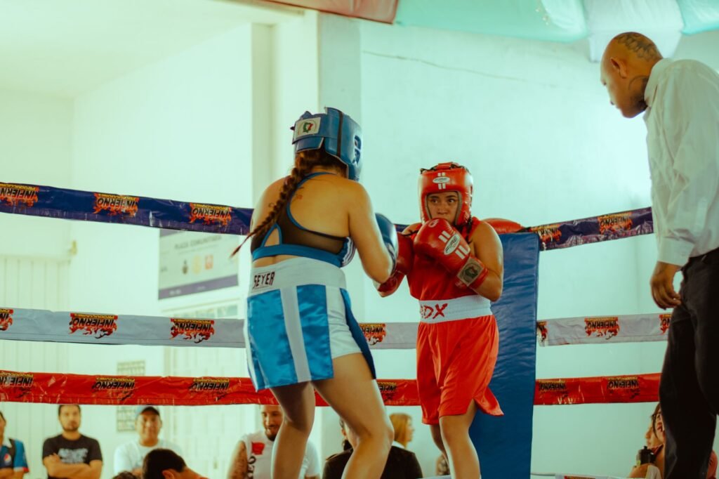 Thematic lead image: boxing ring, medical team — Boxing's existential crisis: Neurological risk and the future of combat sports | National Times
