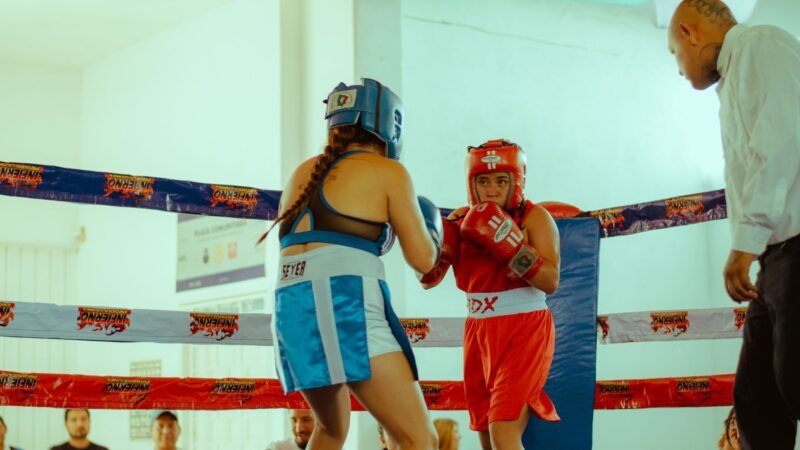 Thematic lead image: boxing ring, medical team — Boxing's existential crisis: Neurological risk and the future of combat sports | National Times
