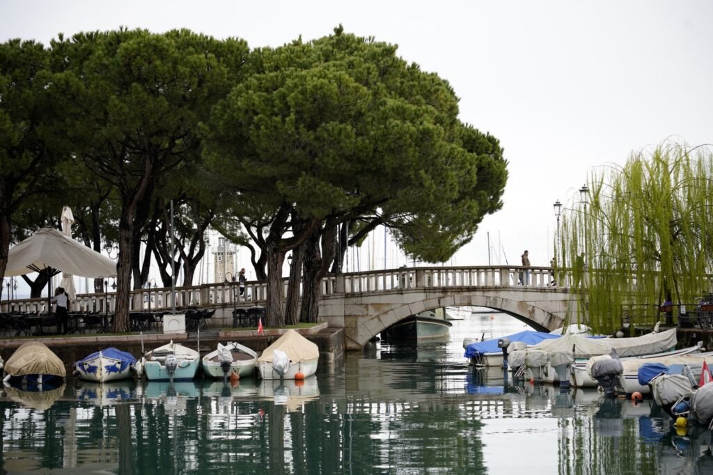 Thematic lead image: wildfire, climate change, tourism — Lake Garda Fire: A Harbinger of Mediterranean Climate Migration | National Times
