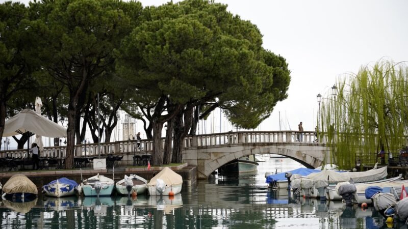 Thematic lead image: wildfire, climate change, tourism — Lake Garda Fire: A Harbinger of Mediterranean Climate Migration | National Times