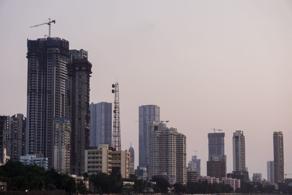 Thematic lead image: financial district, students protesting — India's Capital Inflow Challenge Amidst Domestic Unrest | National Times