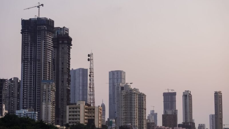 Thematic lead image: financial district, students protesting — India's Capital Inflow Challenge Amidst Domestic Unrest | National Times
