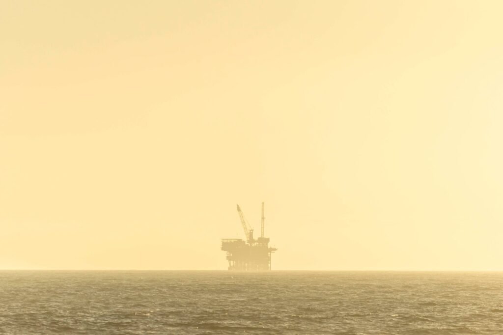 Thematic lead image: oil derricks at sunset — US-Venezuela Oil Deal: Economic Opportunity or Political Precedent? | National Times