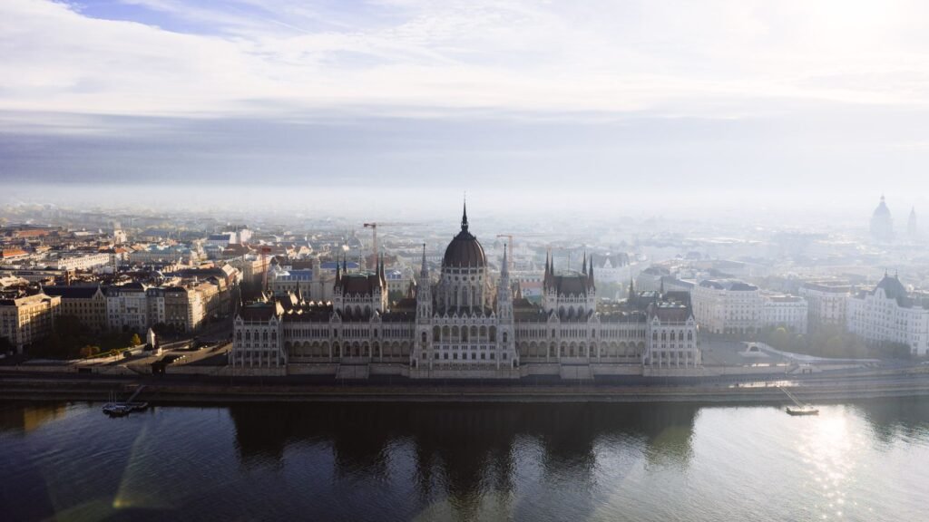 Thematic lead image: Hungarian Parliament, Euro currency — Hungary's Euro Ambition: A Strategic Shift or Economic Necessity? | National Times