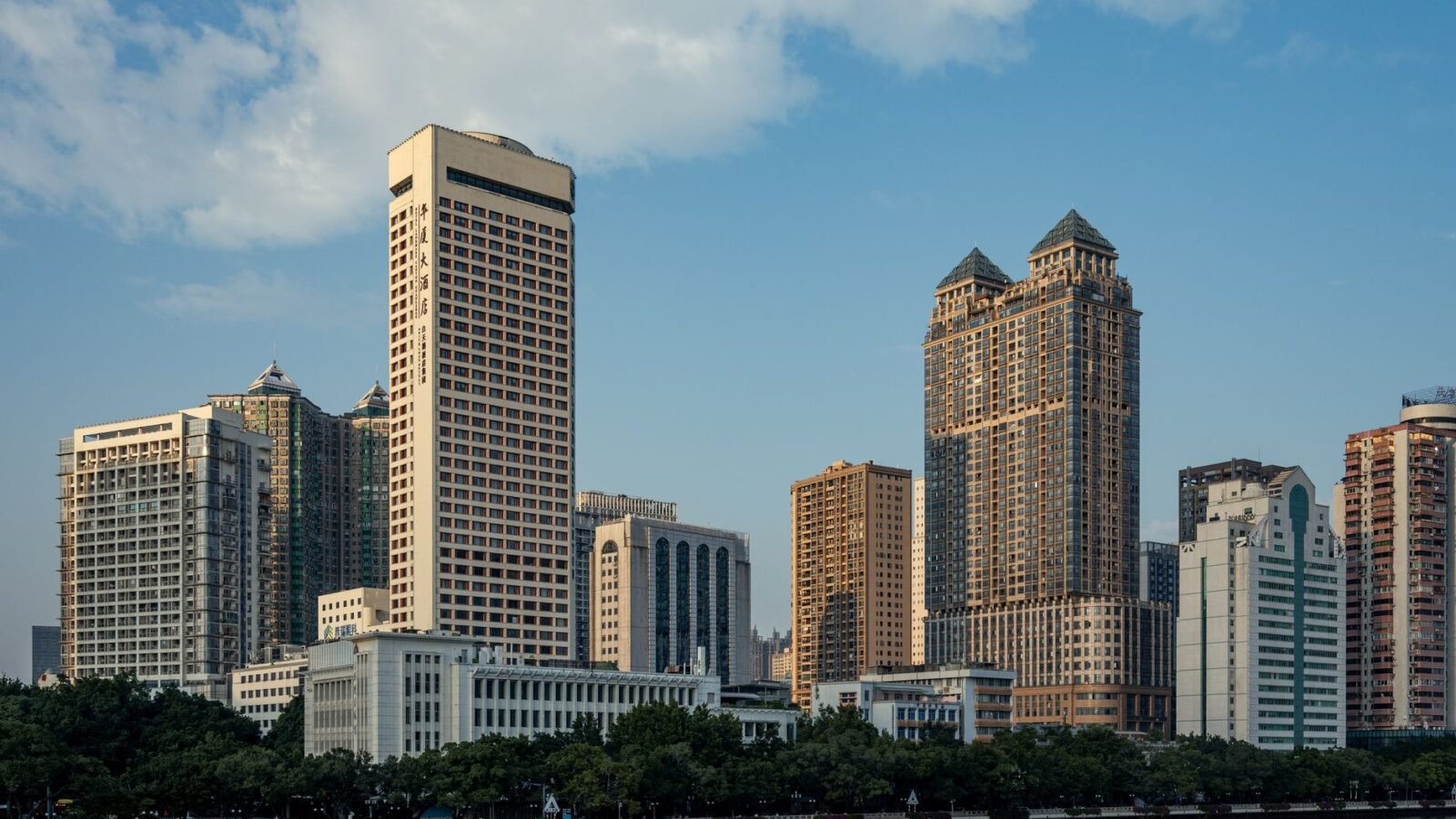 Thematic lead image: Evergrande headquarters, bankruptcy — Evergrande Founder's Life Sentence: Deterrence or Damage Control? | National Times
