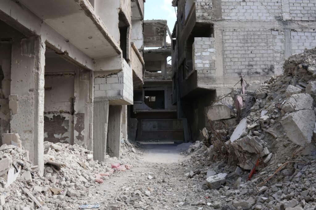 Thematic lead image: damaged buildings, conflict — Sudan's Political Crossroads: Dialogue Pledges and Future Scenarios to 2030 | National Times