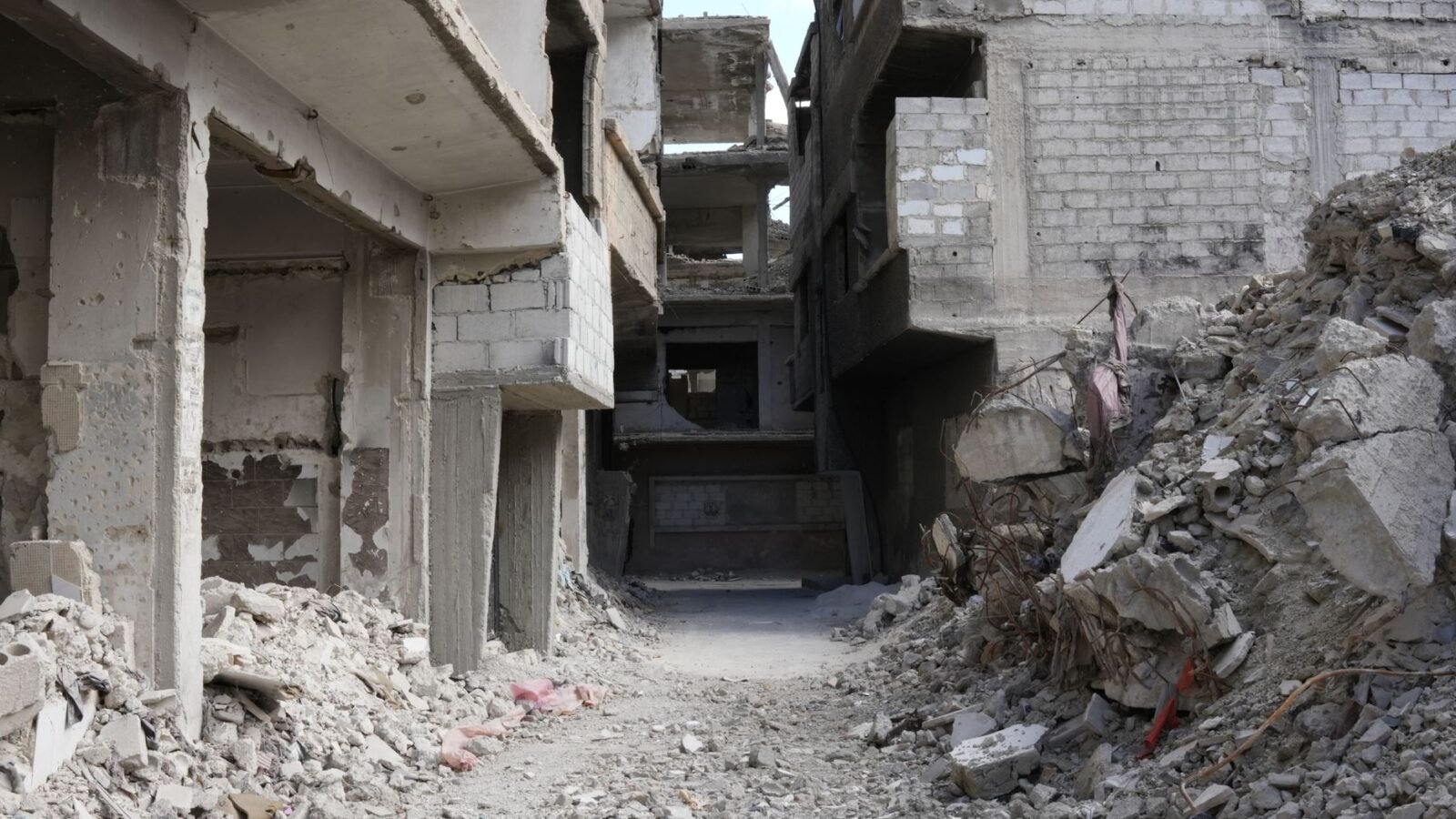 Thematic lead image: damaged buildings, conflict — Sudan's Political Crossroads: Dialogue Pledges and Future Scenarios to 2030 | National Times