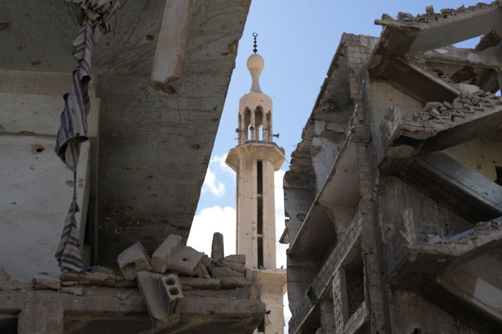 Thematic lead image: destroyed buildings, urban conflict — Gaza Police Chief Killing Escalates Governance Challenge | National Times