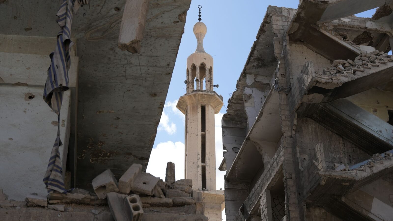 Thematic lead image: destroyed buildings, urban conflict — Gaza Police Chief Killing Escalates Governance Challenge | National Times