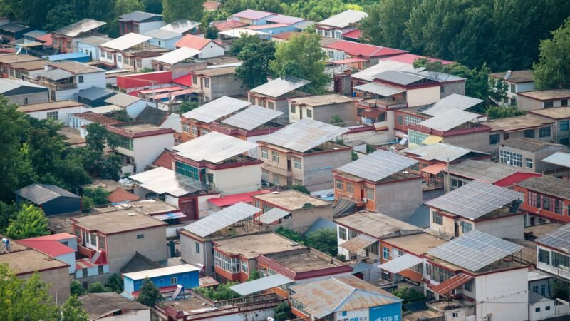Thematic lead image: solar panels, electricity grid, power lines — China's Power Trading Ambitions Face Grid Integration Challenge | National Times