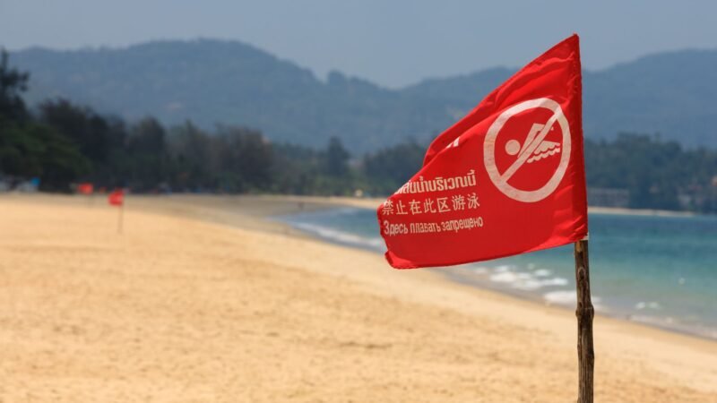 Thematic lead image: tourist destination, protest, flag — Phuket Flag Incident: A Microcosm of Geopolitical Risk for Tourism | National Times
