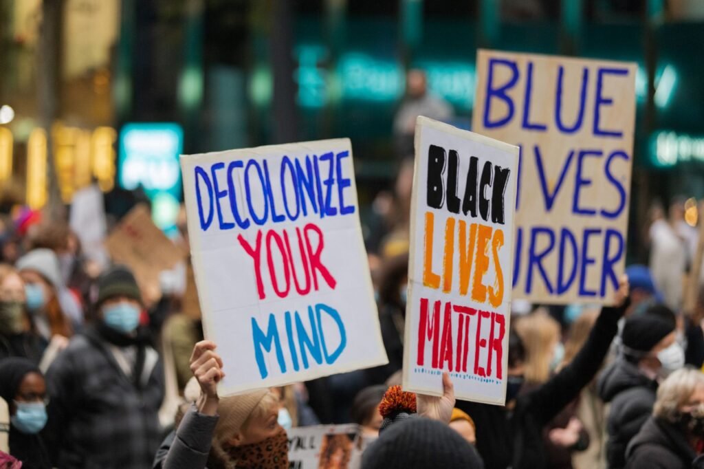 Thematic lead image: racial justice protest — Racial Justice Advocacy Confronts Institutional Power Through 2030 | National Times