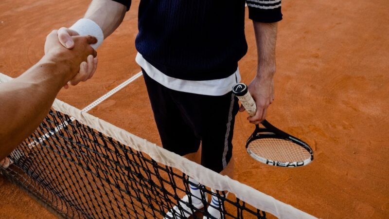 Thematic lead image: tennis court, players — Tennis Upsets: A Microcosm of Market Disruption or Statistical Noise? | National Times