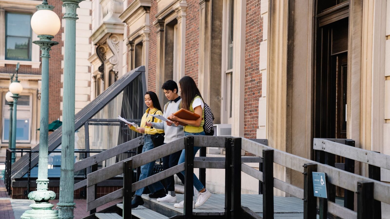 Thematic lead image: university campus, students — UC Faculty Challenge Test-Blind Admissions Amid Grade Inflation Concerns | National Times