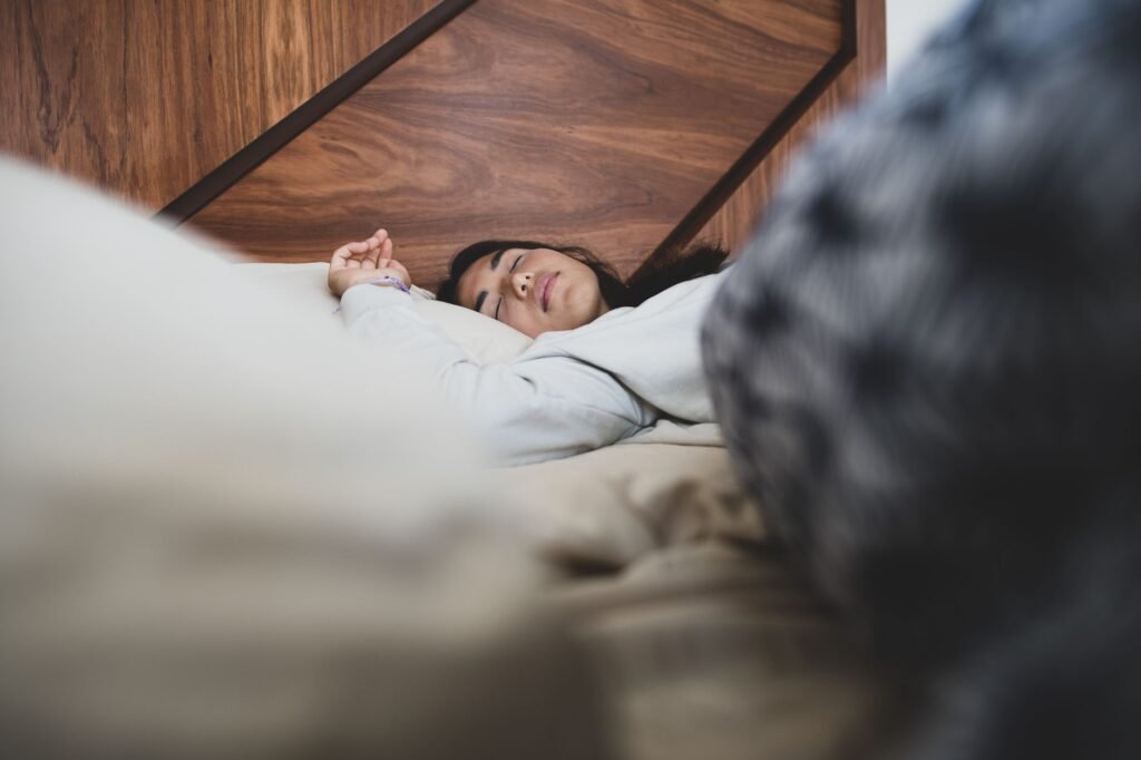 Thematic lead image: person sleeping in bed — Weekend Sleep Catch-Up: A New Public Health Frontier | National Times