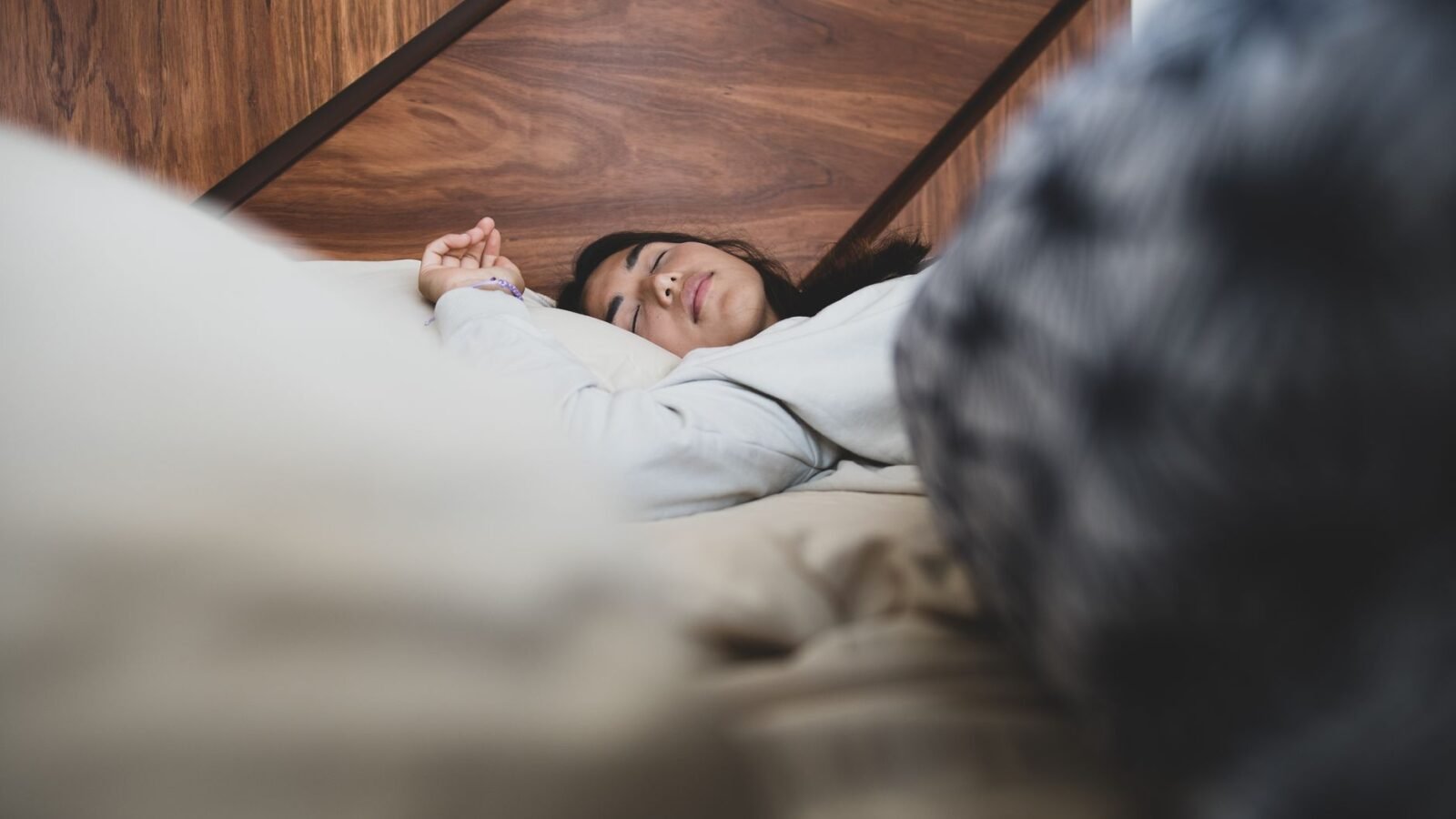 Thematic lead image: person sleeping in bed — Weekend Sleep Catch-Up: A New Public Health Frontier | National Times