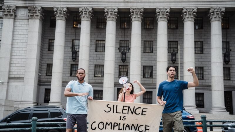 Thematic lead image: protest, courthouse, legal proceedings — Tate Bail Hearing: A Test of Influence Beyond Legal Precedent | National Times