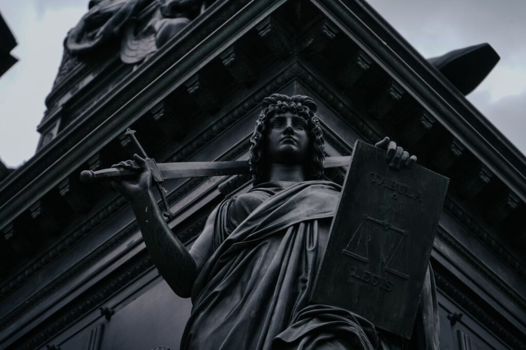 Thematic lead image: legal scales, public opinion — Bondi Hero's Charges Dropped: A Test of Public Narrative vs. Legal Process | National Times