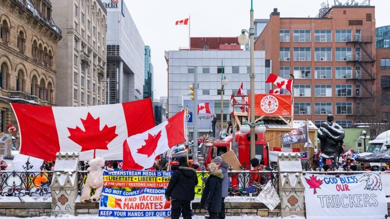 Thematic lead image: Parliament Hill, Canadian flag — Canada-US Tariffs: Unpacking the Second-Order Geopolitical Implications | National Times