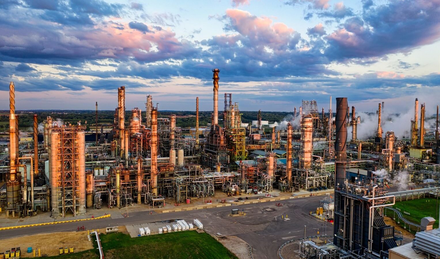 Thematic lead image: oil refinery, stock market — Dangote's Public Offering: A Catalyst for Nigerian Capital Markets? | National Times