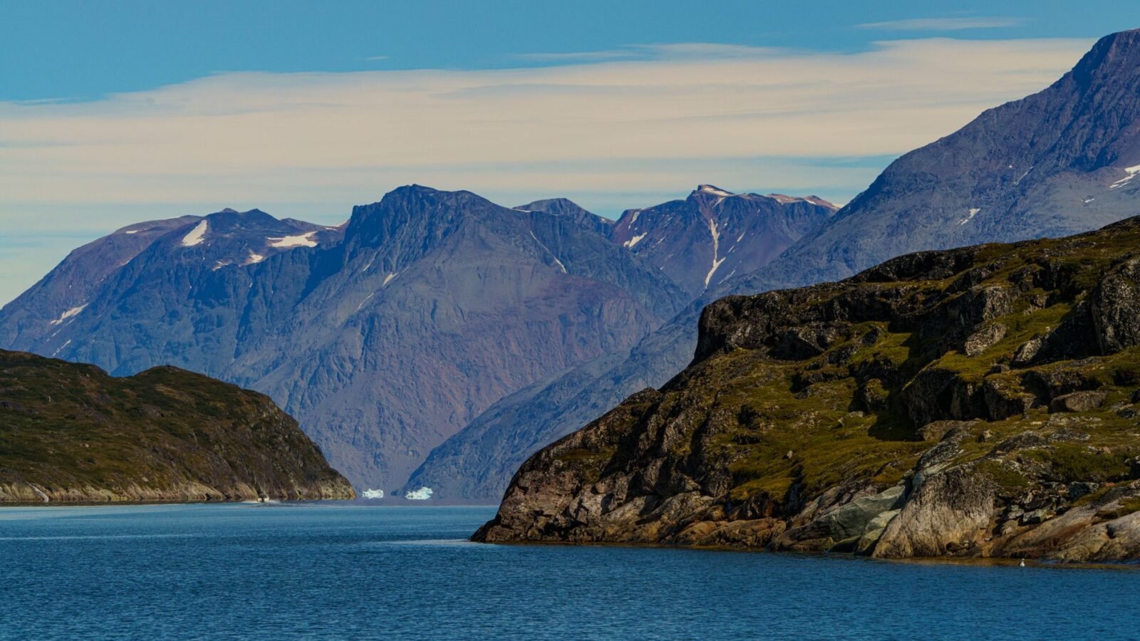 Thematic lead image: Greenlandic landscape, US flag — US-Denmark Greenland Pact: Sovereignty, Security, or Strategic Ambiguity? | National Times