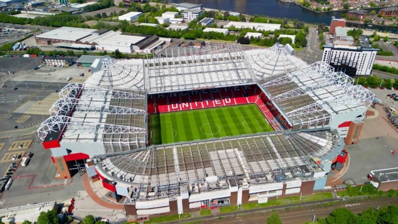 Thematic lead image: Football stadium and city skyline — Premier League Stability: Beyond the Match-Day Narrative | National Times