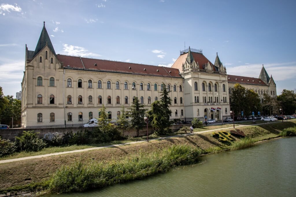 Thematic lead image: international court building, river — Indus Waters Treaty: Arbitration Upholds Pact Amidst Indian Rejection | National Times